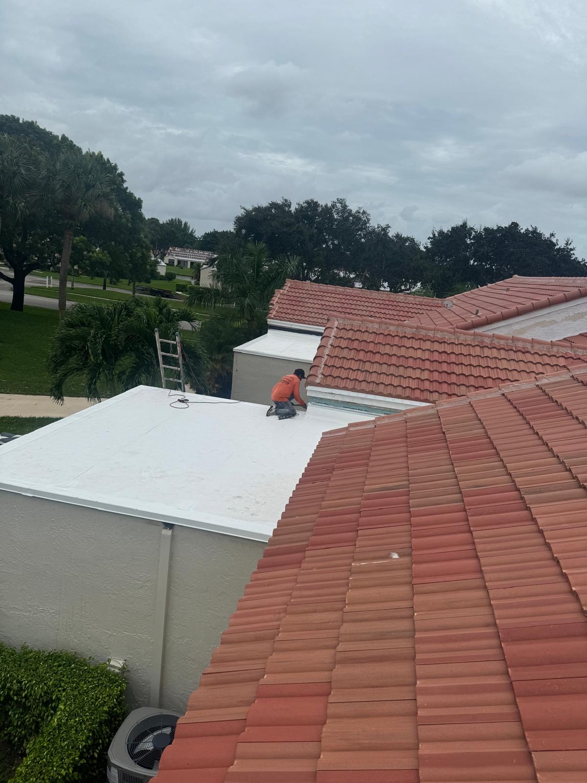 Tile to flat roof transition detail on a South Florida roof replacement